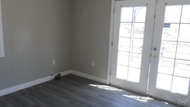 doorway to outside with plenty of natural light, french doors, and wood finished floors