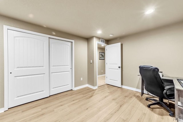 office with light wood finished floors, baseboards, visible vents, and recessed lighting