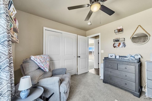 living area featuring ceiling fan and light colored carpet