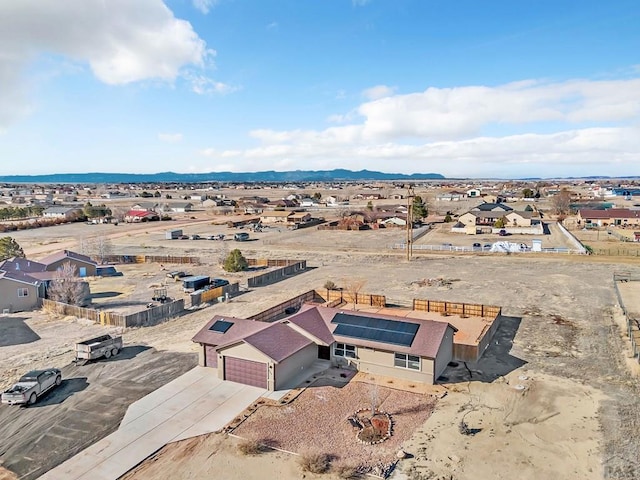 birds eye view of property featuring a desert view and a mountain view