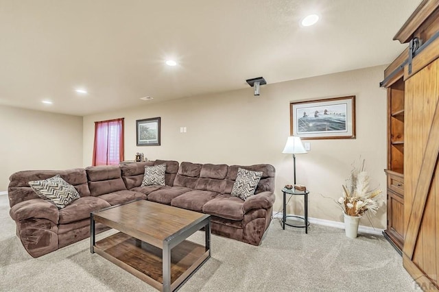 living room featuring carpet, baseboards, and recessed lighting