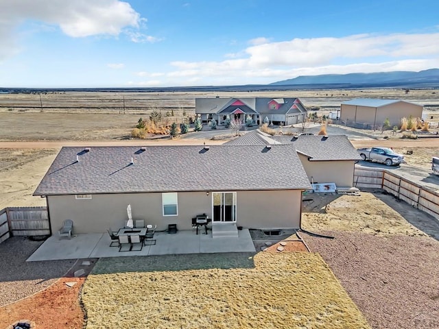 drone / aerial view featuring a mountain view