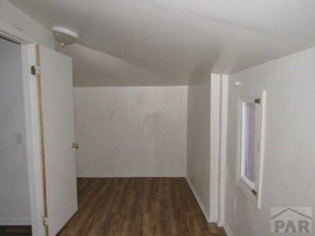 1119 Pine St, Pueblo, CO 81004 - hallway featuring wood finished floors and lofted ceiling