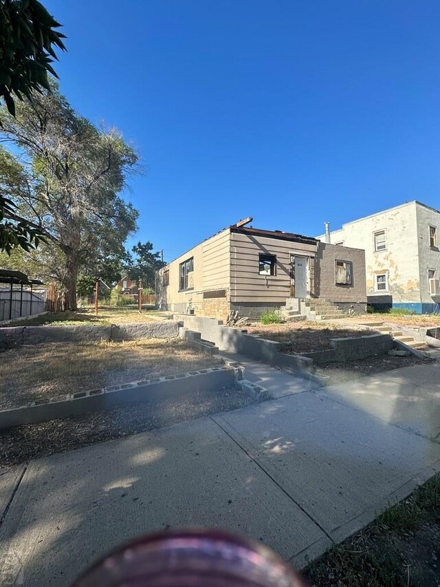 view of property exterior featuring fence