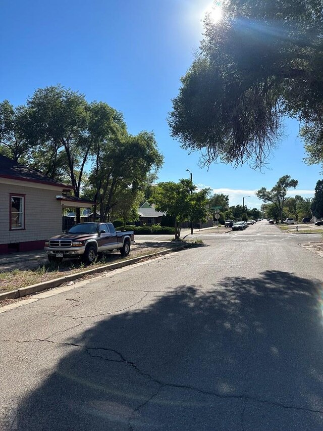 view of road with curbs and sidewalks