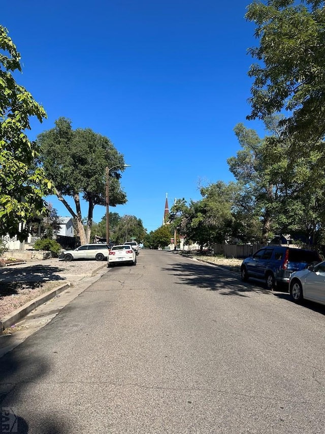 view of street featuring curbs and sidewalks