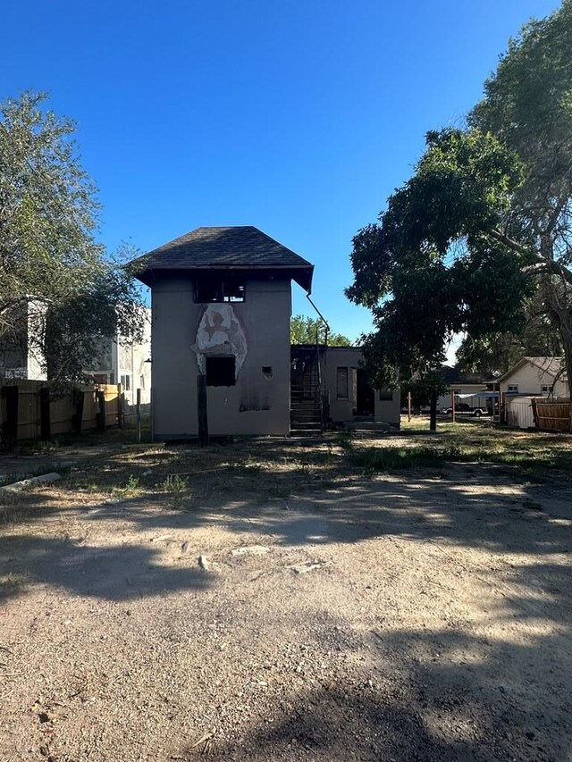 view of outbuilding with fence