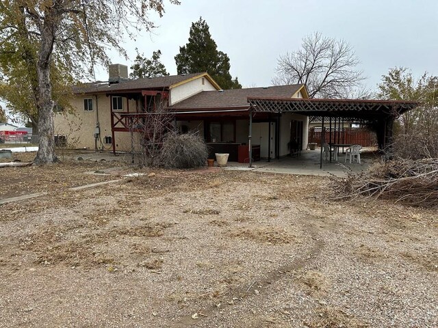 back of property featuring a patio