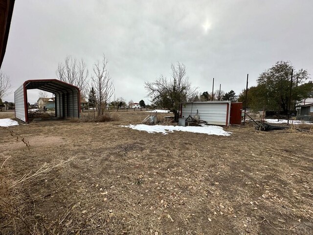 view of yard with a carport