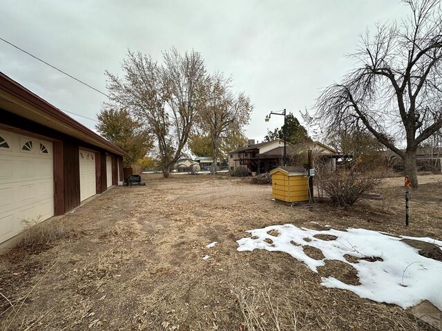 view of yard featuring a garage