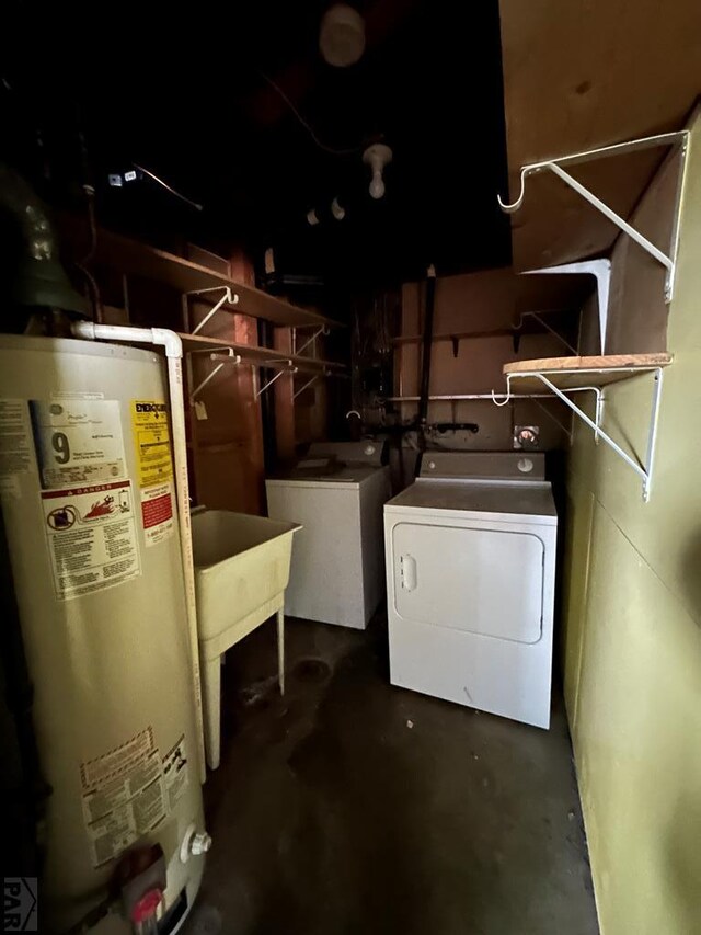 interior space with independent washer and dryer, laundry area, and gas water heater