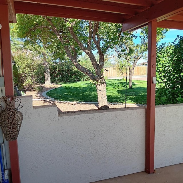 view of patio featuring fence