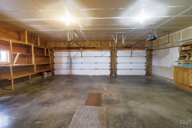 garage featuring a garage door opener