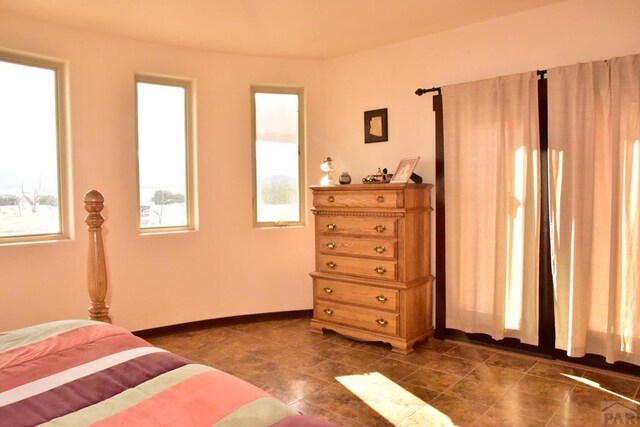 bedroom featuring baseboards