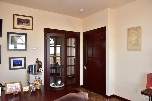 tiled entrance foyer with french doors