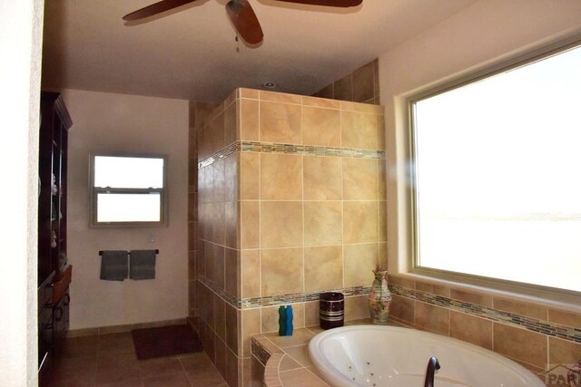 bathroom featuring tiled shower, a jetted tub, and a healthy amount of sunlight