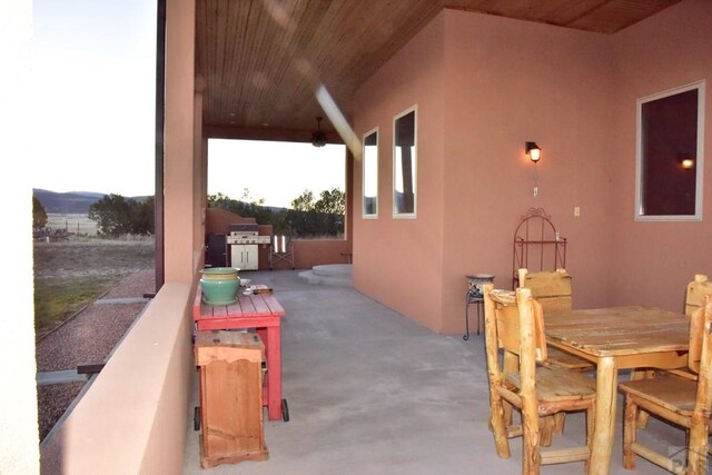 view of patio with outdoor dining area and area for grilling