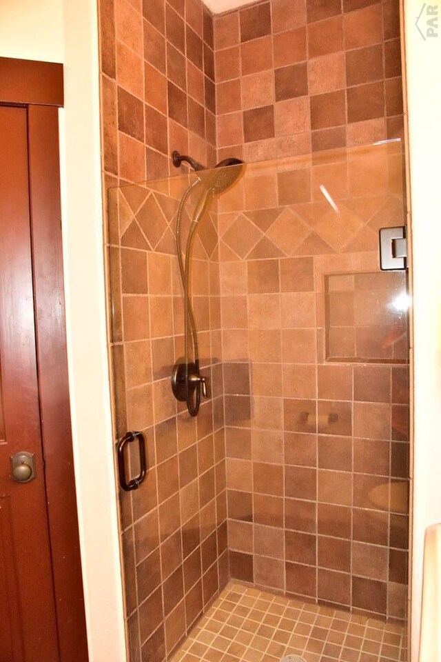 bathroom featuring a shower stall