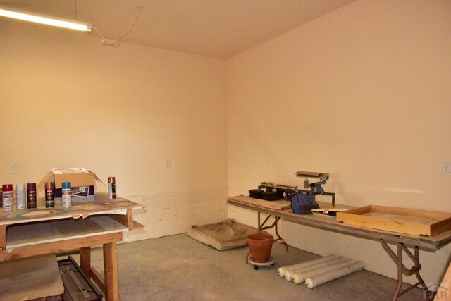 office featuring concrete flooring and a workshop area