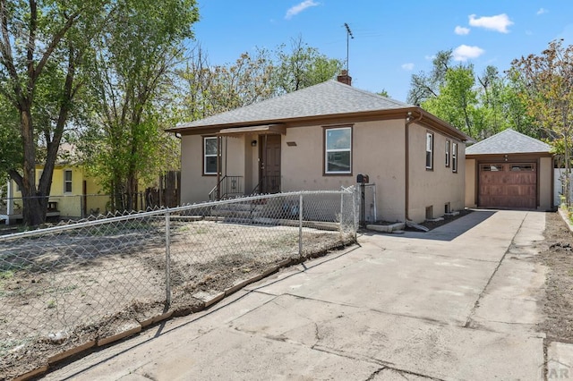 1934 E 11th St, Pueblo, CO 81001 - bungalow-style home featuring stucco siding, a chimney, a fenced front yard, concrete driveway, and roof with shingles