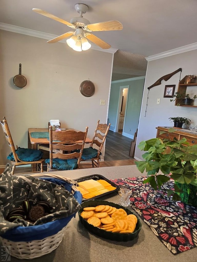 178 Macneil Pl, Pueblo, CO 81001 - dining space featuring ornamental molding, a ceiling fan, and wood finished floors