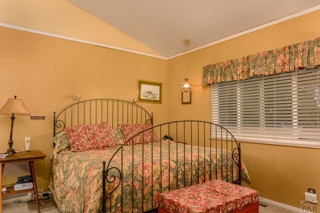 bedroom with ornamental molding, lofted ceiling, carpet floors, and a textured ceiling