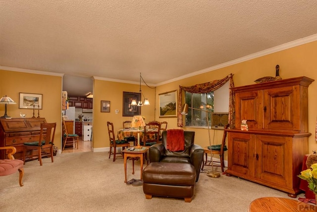 sitting room with crown molding, a textured ceiling, an inviting chandelier, and light carpet