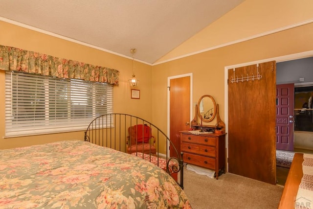 carpeted bedroom featuring lofted ceiling and crown molding