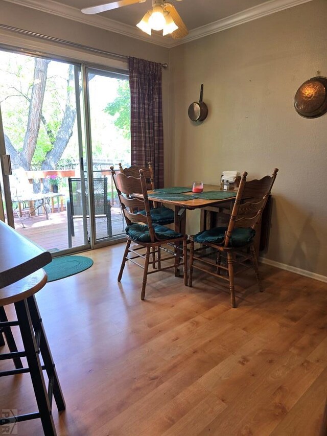178 Macneil Pl, Pueblo, CO 81001 - dining space featuring light wood finished floors, crown molding, baseboards, and a ceiling fan