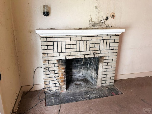2614 E Orman Ave, Pueblo, CO 81004 - detailed view of a fireplace and baseboards
