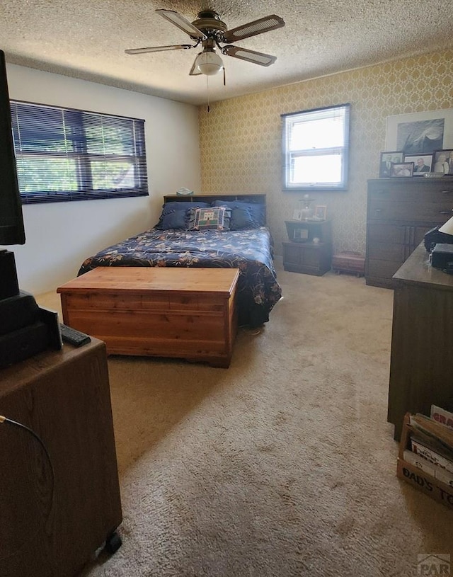 3219 Urban St, Pueblo, CO 81005 - carpeted bedroom with a textured ceiling and ceiling fan