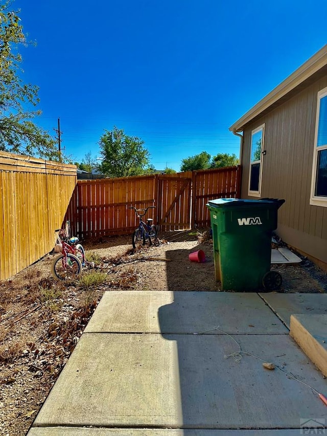 view of yard featuring a patio area and a fenced backyard