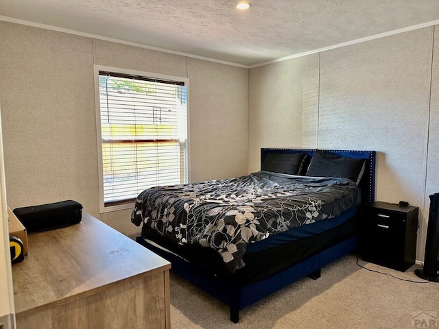 bedroom featuring carpet flooring, crown molding, and a textured ceiling