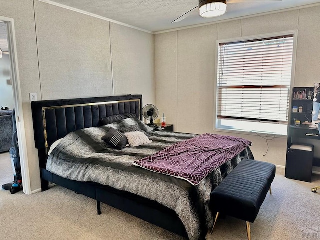 bedroom featuring crown molding, light colored carpet, a decorative wall, and a textured ceiling