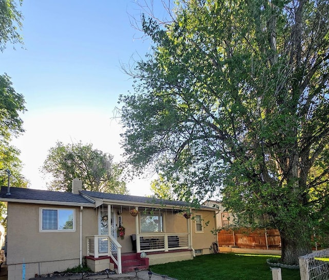 2631 Norwich Ave, Pueblo, CO 81003 - view of front of property featuring stucco siding and a chimney