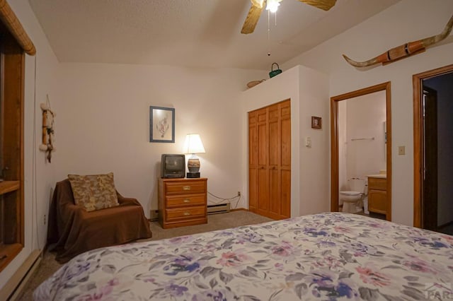 bedroom with a baseboard heating unit, ceiling fan, light carpet, and ensuite bathroom