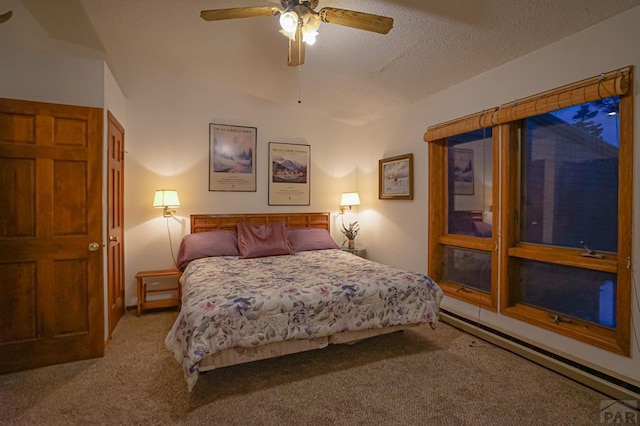 carpeted bedroom featuring a baseboard radiator, a ceiling fan, and a textured ceiling