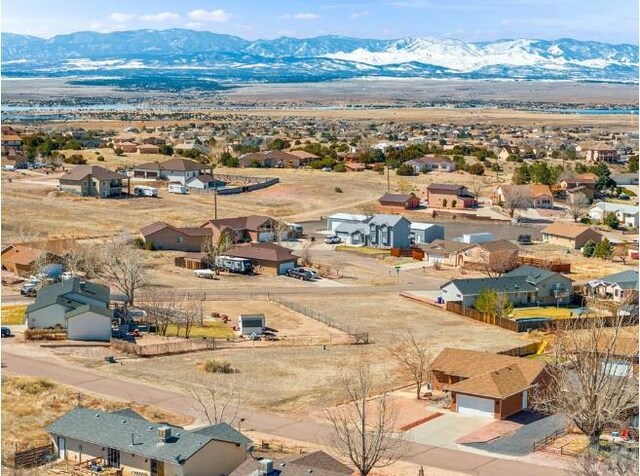 drone / aerial view with a residential view and a mountain view