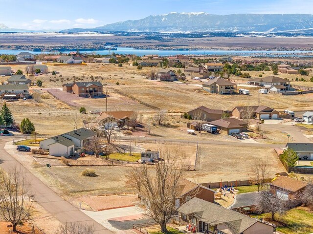 birds eye view of property with a residential view and a mountain view