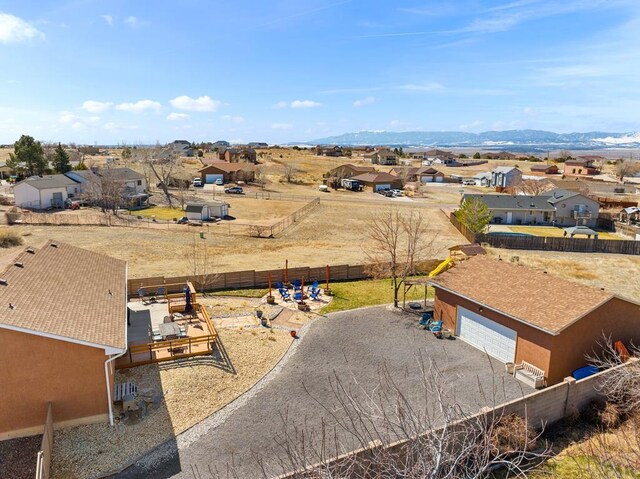 birds eye view of property with a residential view and a mountain view