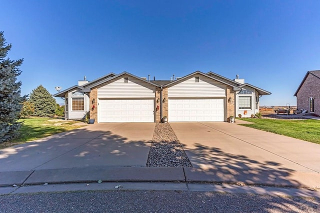 ranch-style house with a front lawn, brick siding, driveway, and an attached garage