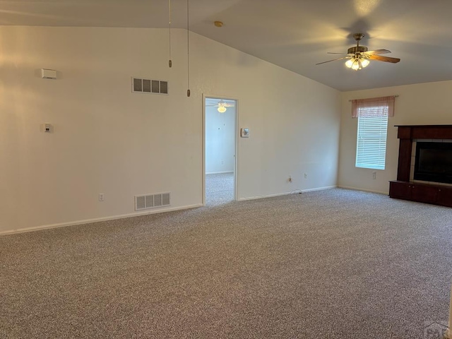 unfurnished living room with carpet floors, visible vents, ceiling fan, and baseboards