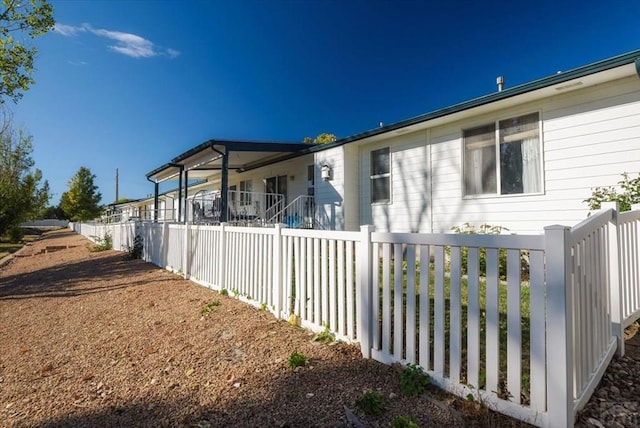 view of property exterior featuring fence