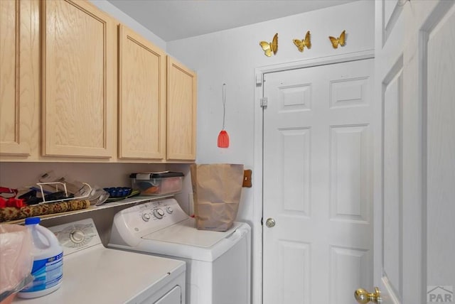 washroom with cabinet space and independent washer and dryer