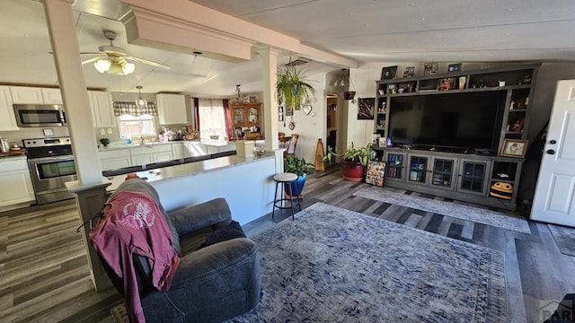 living area with vaulted ceiling with beams, dark wood-style floors, and ceiling fan