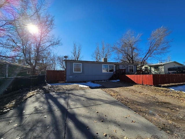 view of front of house featuring fence