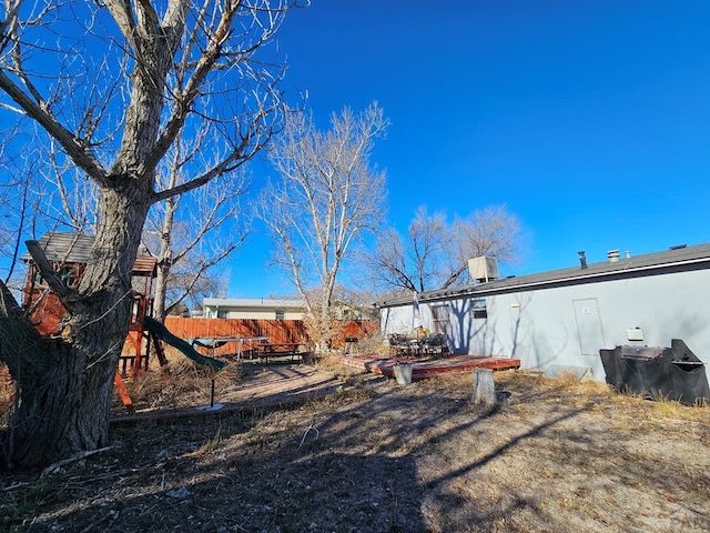 back of house featuring fence