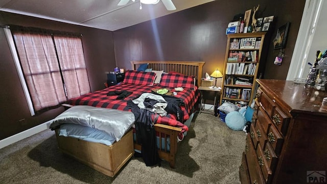 carpeted bedroom featuring baseboards