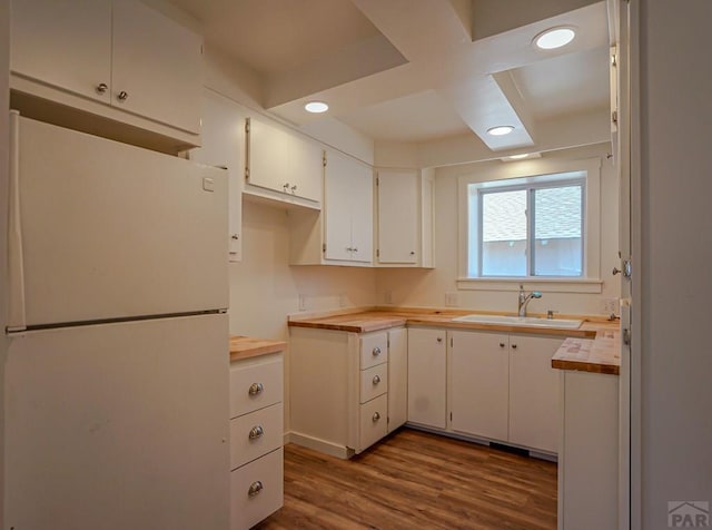 327/327.5 7th St, Walsenburg, CO 81089 - kitchen featuring freestanding refrigerator, butcher block counters, a sink, dark wood-type flooring, and recessed lighting
