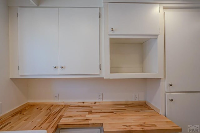 327/327.5 7th St, Walsenburg, CO 81089 - kitchen with white cabinets and wood finished floors